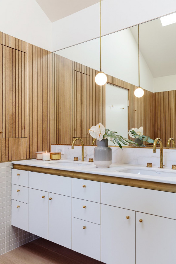 thin slatted wood paneling adds warmth to this bathroom