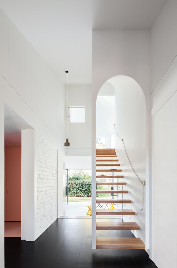 this stairway gets a very on trench arch treatment