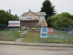 A rundown, tired looking house that was torn down to be replaced by a dream custom home built by Wallmark for the homeowners.